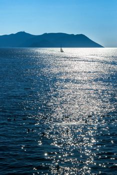 Small sailing yacht on the calm sea