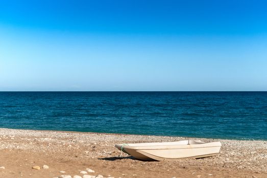Boat on the beach with sea background