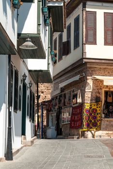 View of an old town street with carpet shop in Antalya, Turkey