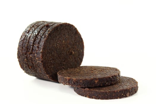 some slices of pumpernickel bread on a white background