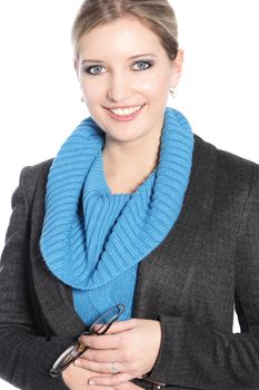 Smiling businesswoman holding her glasses in a front view shot