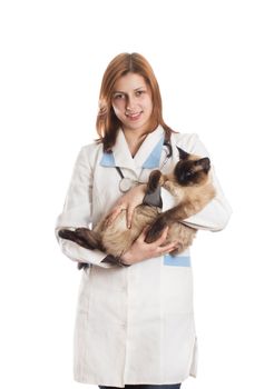 veterinarian with a Siamese cat in her arms on a white background isolated