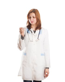 female doctor looks at the thermometer on a white background isolated