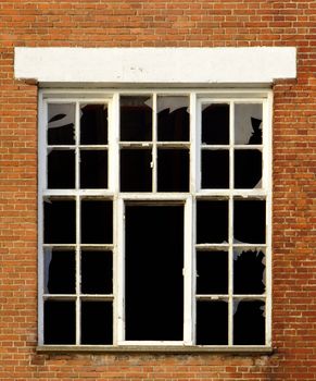 Old wall with broken glass window