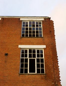 Brick wall with broken windows