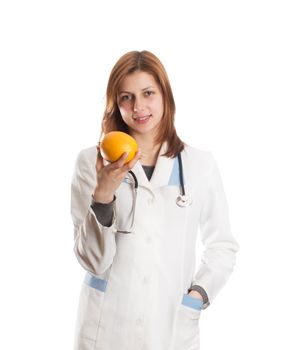 female doctor offers an orange on a white background isolated