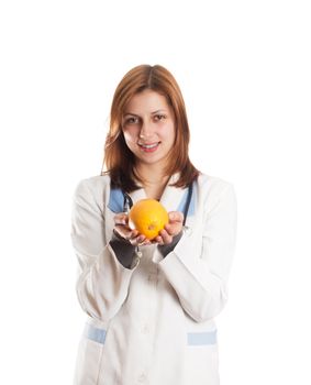 doctor in medical uniform holding an orange in her hands, isolated on white background