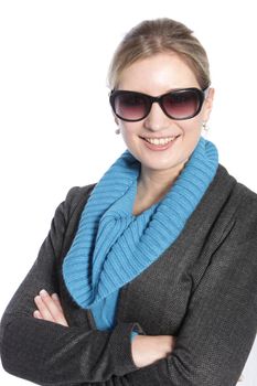 Smiling casual woman wearing sunglasses with her crossed arms