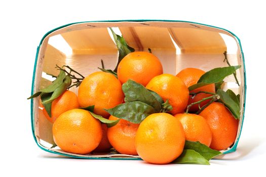fresh tangerines in a basket on white background