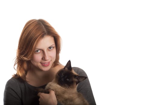 pretty girl with a Siamese cat on a white background isolated