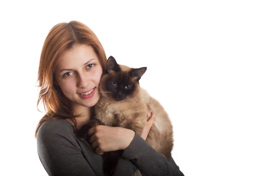 lovely girl with a Siamese cat on a white background isolated