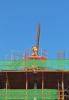 Building under construction with worker