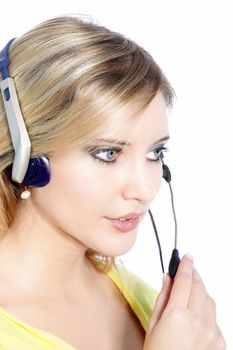 Young pretty call center agent wearing a phone headset