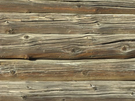 Fragment of old country colorless wooden house wall, useful as background