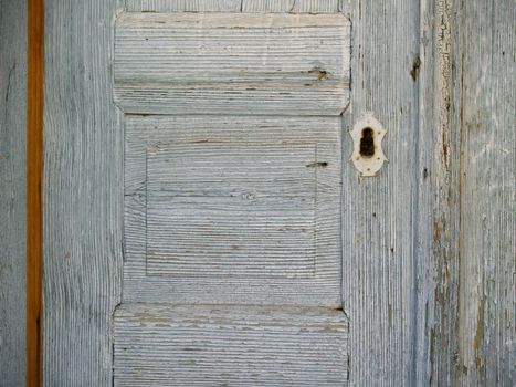 detail of an old weathered wooden door