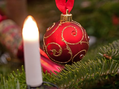 Hanging Christmas decorations ornaments on a tree