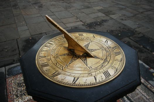Old sun dial in a park setting