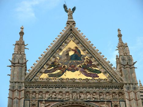 Siena - Duomo facade.The large central mosaic, the Coronation of the Virgin, is the work of Luigi Mussini