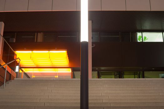 Entrance of a 1970s office building at night