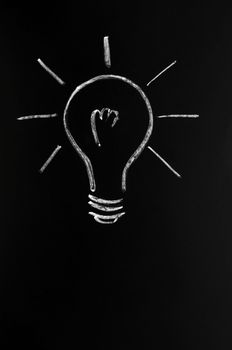 Light bulb drawn with chalk, symbol of innovation and idea