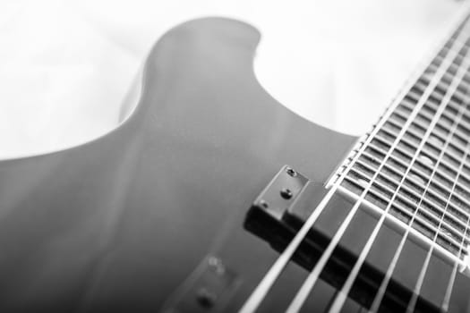 Electric guitar detail shots over white backdrop