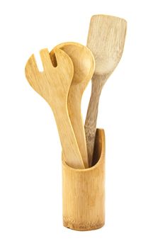 Wooden kitchen utensils over white backdrop