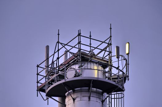 Industrial refinery tower in beautiful early morning light.