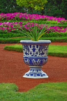 Porcelain vase with the flower as an element of landscape design