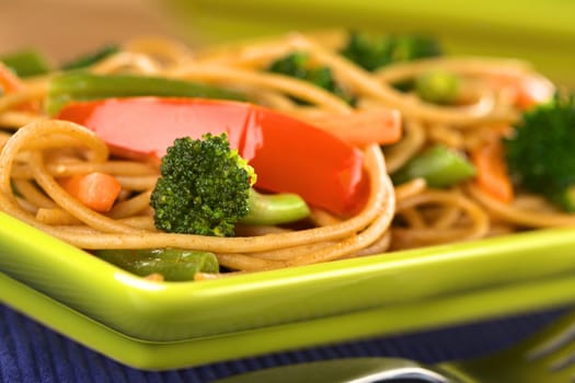 Vegetable and wholewheat spaghetti stir fry (Selective Focus, Focus on the broccoli floret in the front)