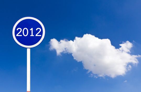 Round sign 2012 New Year concept on blue sky