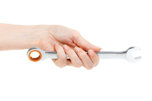 Wrench in female hand. Isolated on white.