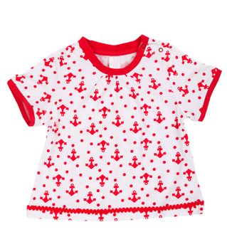 baby dress with a pattern in the shape of an anchor. Isolate on white.