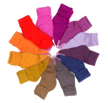 New colored socks stacked around. Isolate on white.