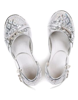Children's fancy shoes isolated on white background. top view