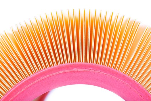 Yellow paper air filter for cars up close. Isolate on white.