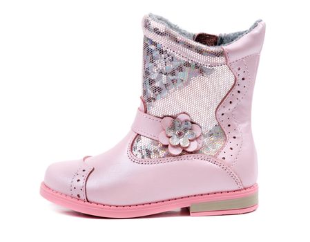 One children's pink leather boots. Isolate on white.