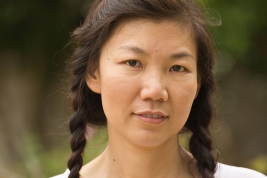 Portrait of a sexy young female smiling in a park - Outdoor