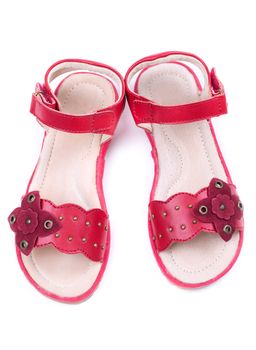 pair of a little girl's red shoes. Isolate on white