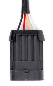 Plastic four-contact electrical connector for the car. Isolate on white.