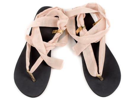 Pair of trendy summer female sandals isolated on white