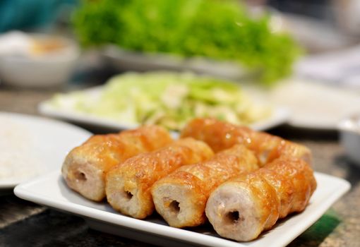 Grilled pork balls with condiments and Peanut Sauce