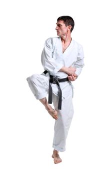 Karate. Man in a kimono with a white background
