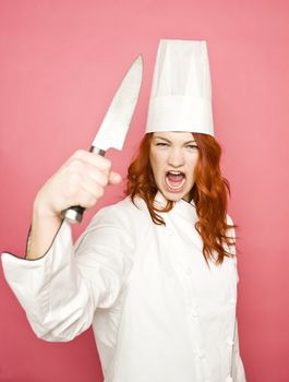 Female Chef on pink background