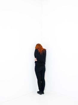 Sad woman in a white room