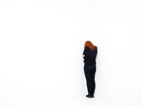 Sad woman in a white room