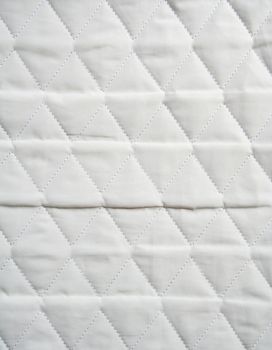The stitched synthetic white fabric can use as background