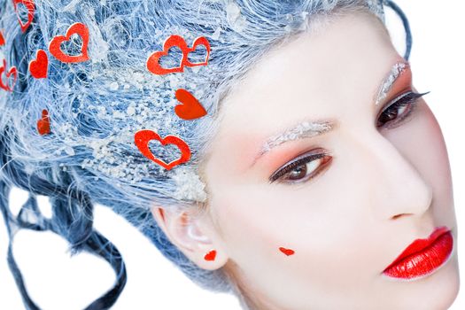 Portrait of young woman frozen face with hearts, looking sad