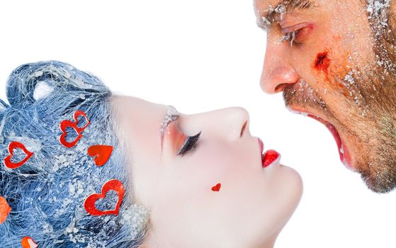 Close-up of wounded man screaming in woman's face, both faces covered with frost, copyspace