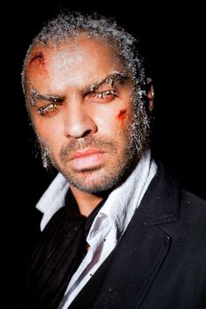 Portrait of man with frost make-up on face on black background