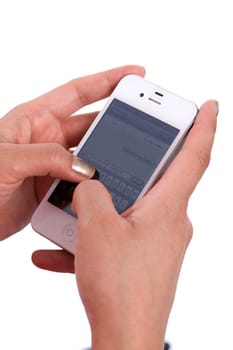 Woman's hands hold a cell phone while texting a message.